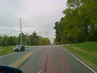 Car Slows Down For Oncoming Fire Engine